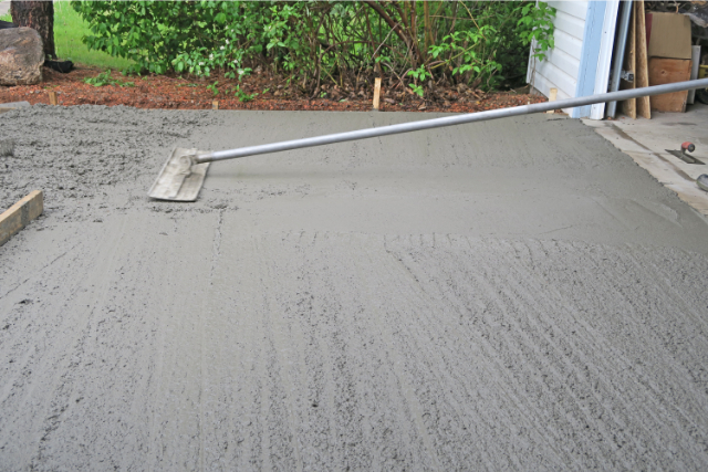 Make a concrete driveway- fresh cement and using float