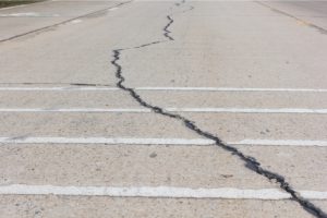Road crack surface of concrete driveway with crack