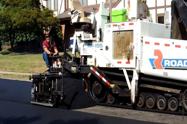 Asphalt Paving workers doing street asphalt paving